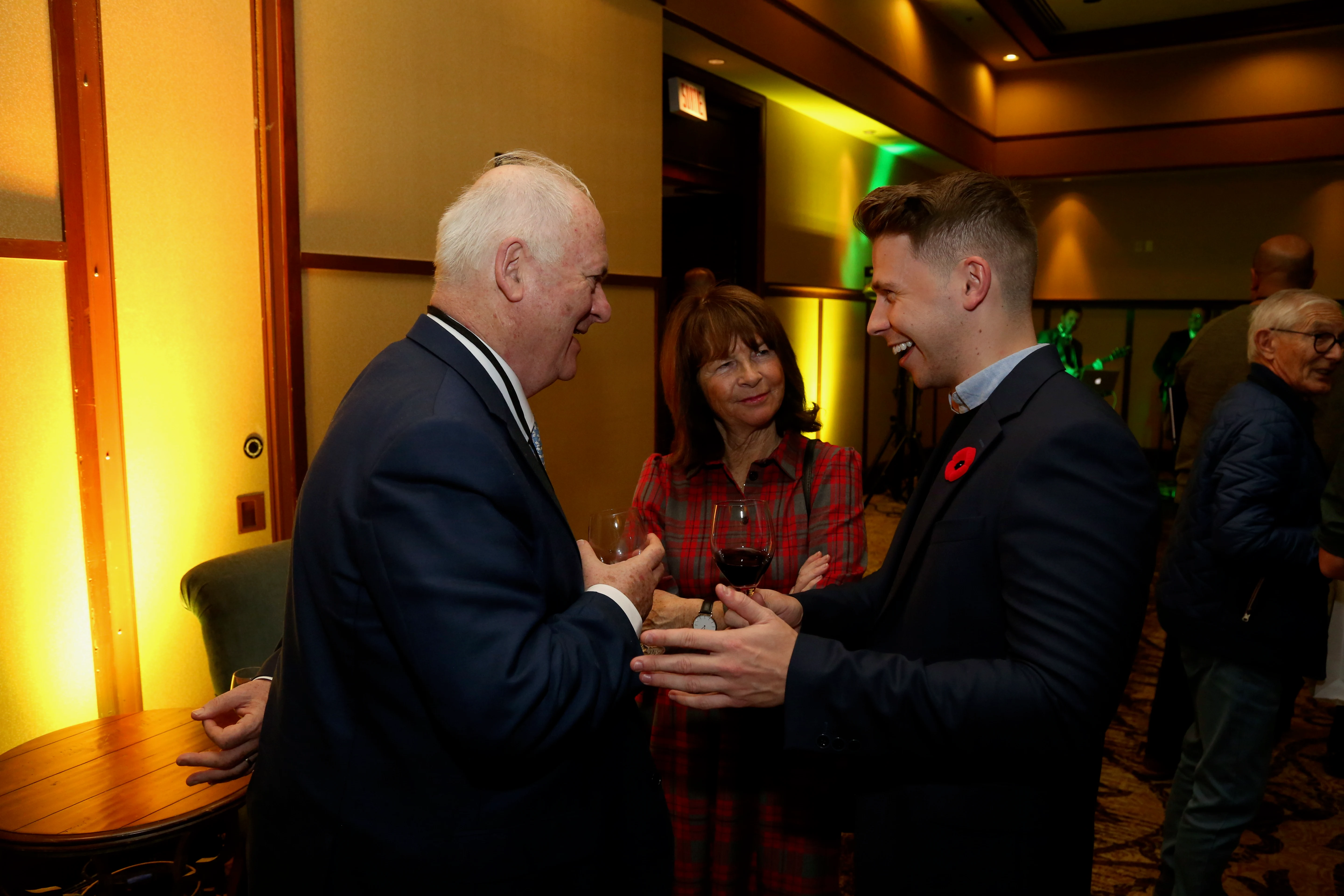 Dale McDermott speaking with former Irish Taoiseach John Bruton and Finola Bruton at the Banff Forum in Mont-Tremblant, Québec