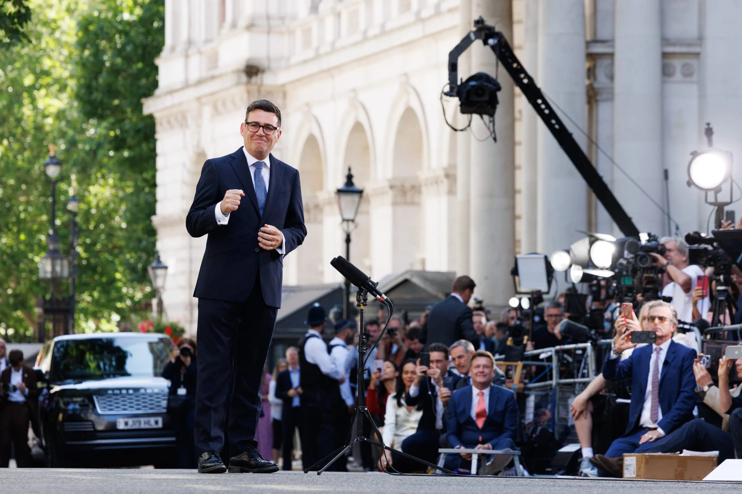 Andy Burnham speaking outside 10 Downing Street without a lectern, facing a bank of press cameras and media