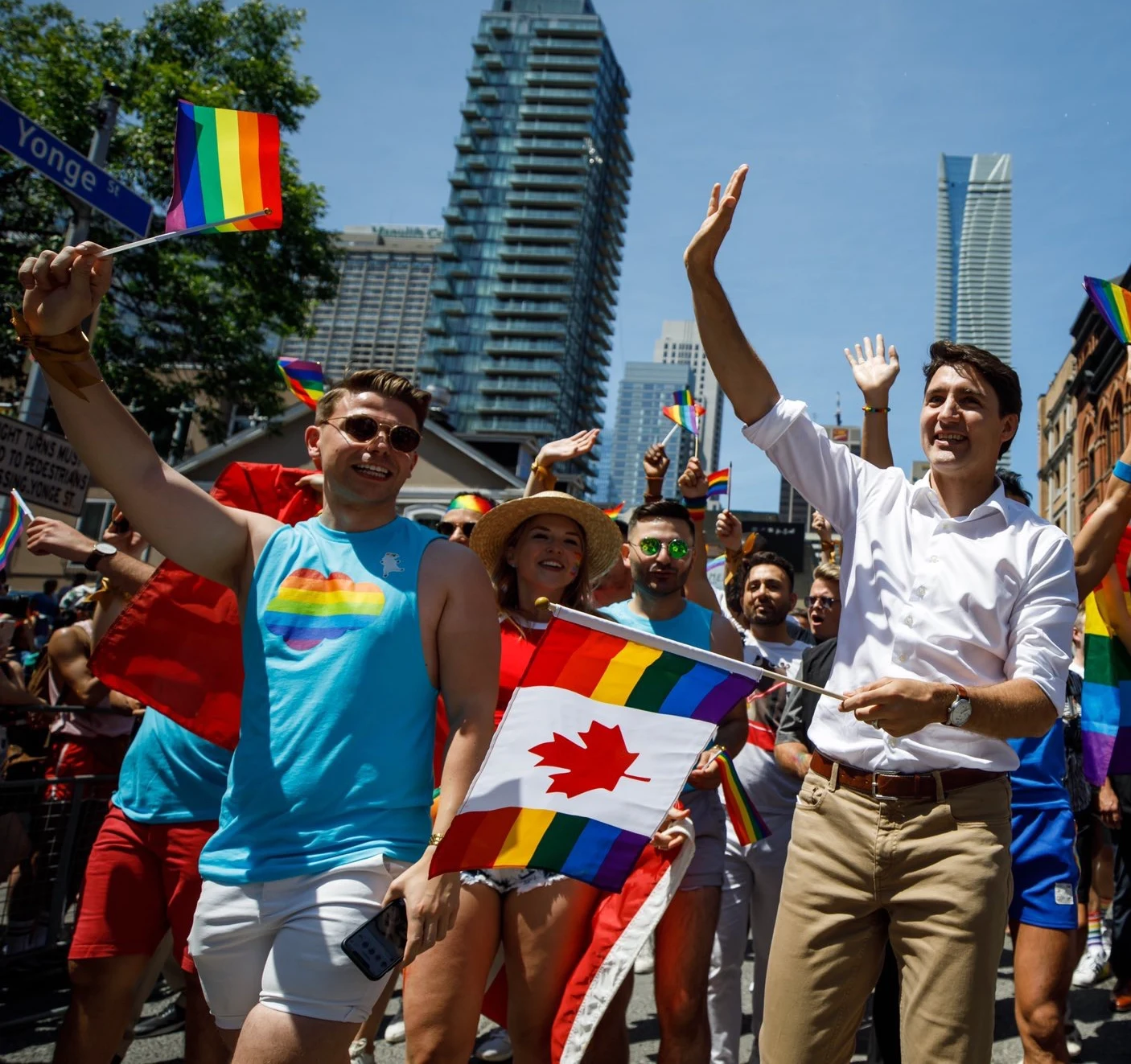 Dale McDermott marching alongside Canadian Prime Minister Justin Trudeau at Toronto Pride
